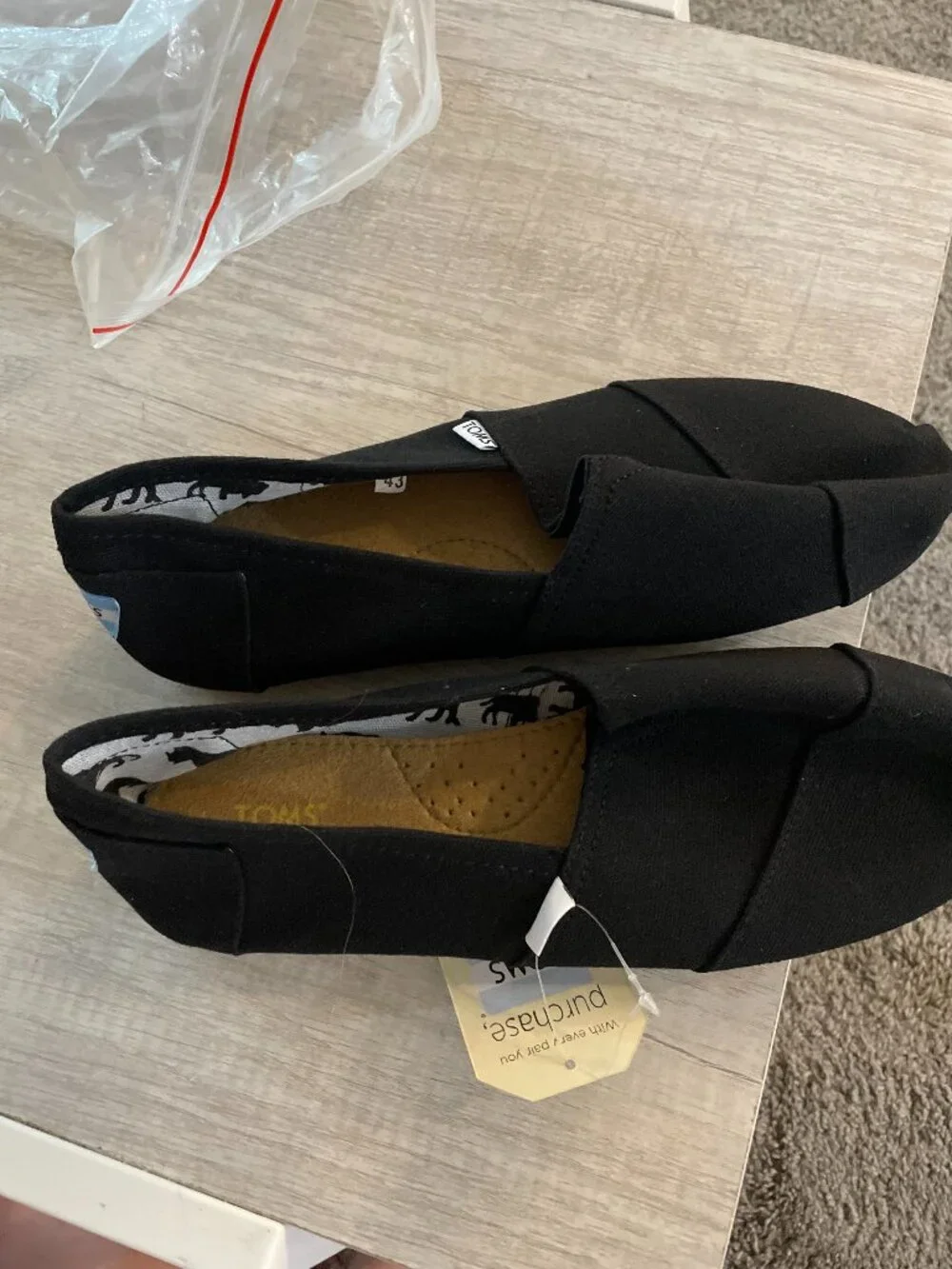 Toms Classic Slip-On Canvas Shoes in Black with Tan Sole